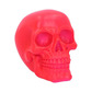 Psychedelic fluorescent skull figurine pink